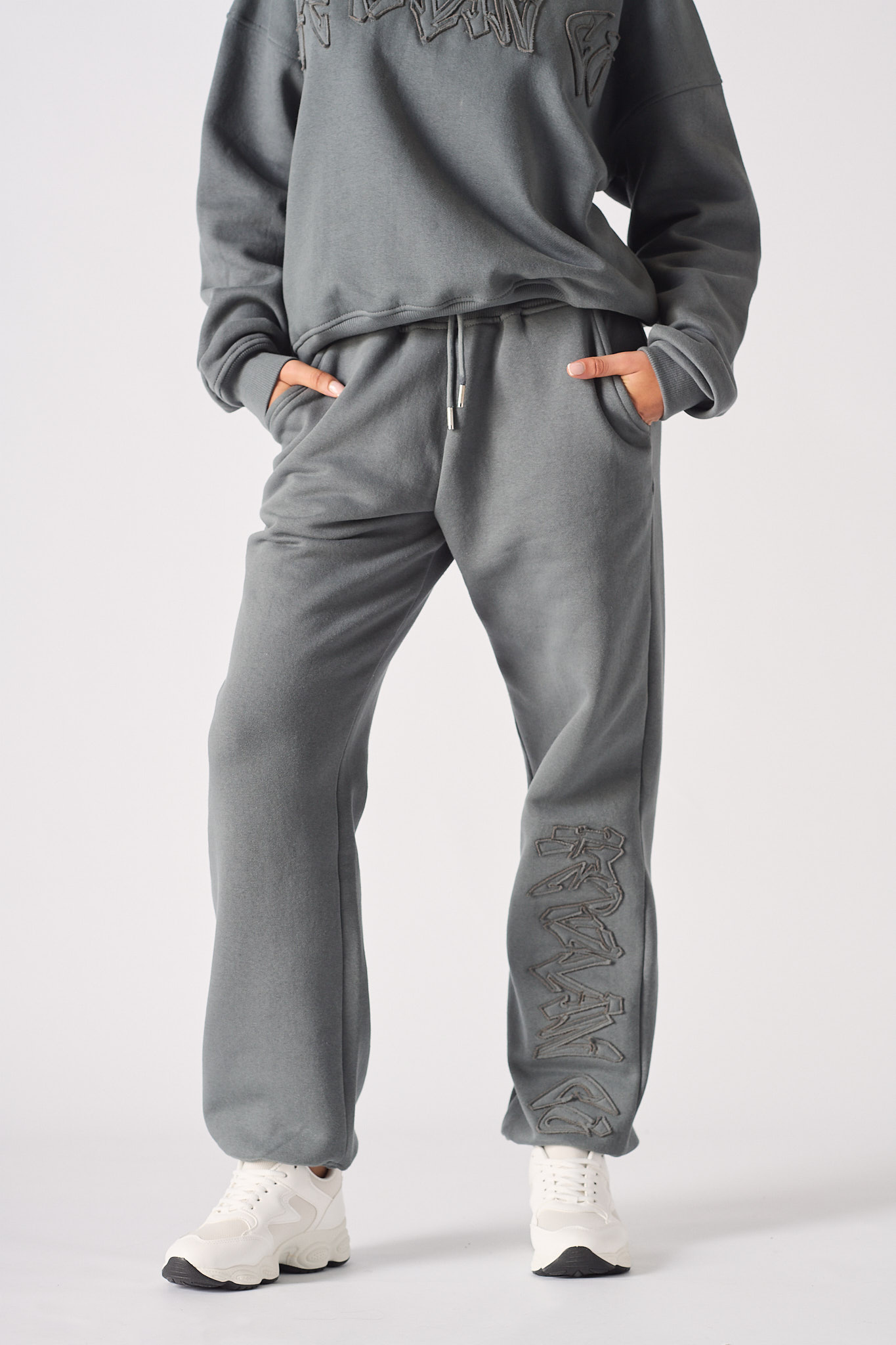 Front view of the women's straight leg cuffed joggers in grey.