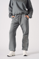 Front view of the women's straight leg cuffed joggers in grey.