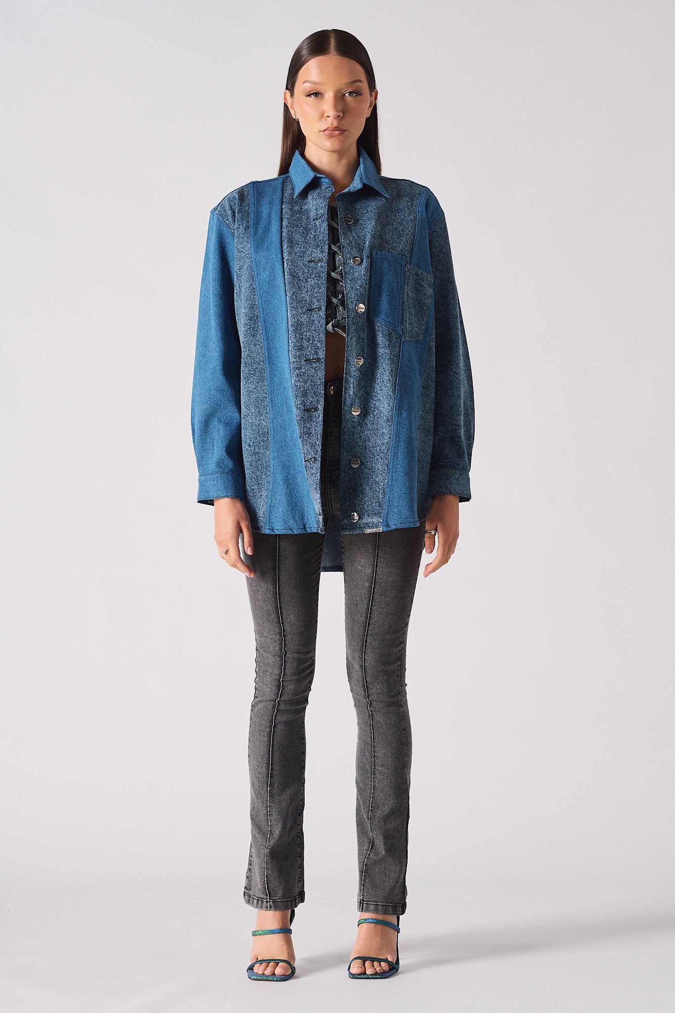 A model showing how to style the blue acid wash denim shirt.