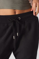 Close-up of the drawstring waist with silver toggles on the women's joggers
