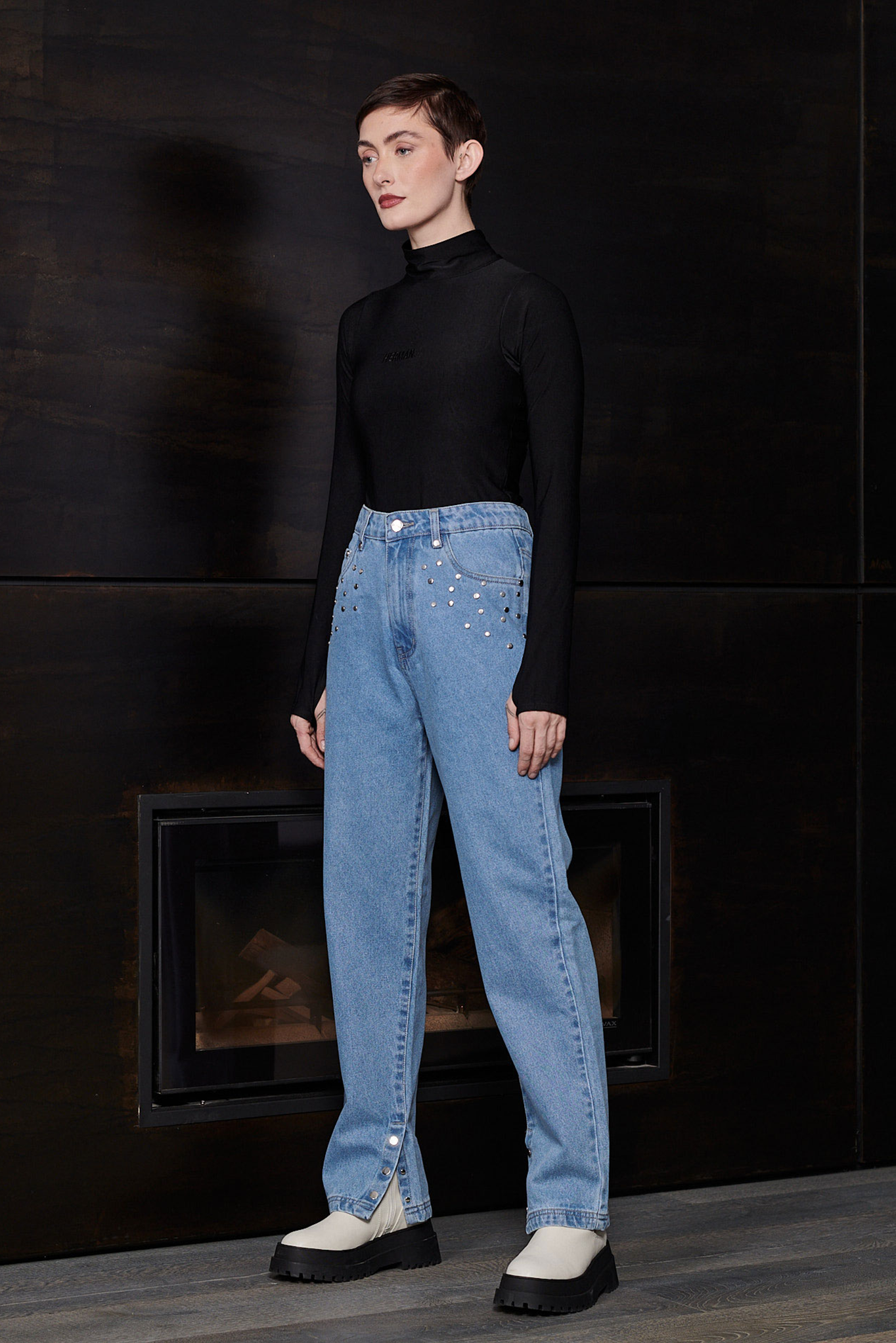 Angled view of the women's turtleneck spandex bodysuit in black.