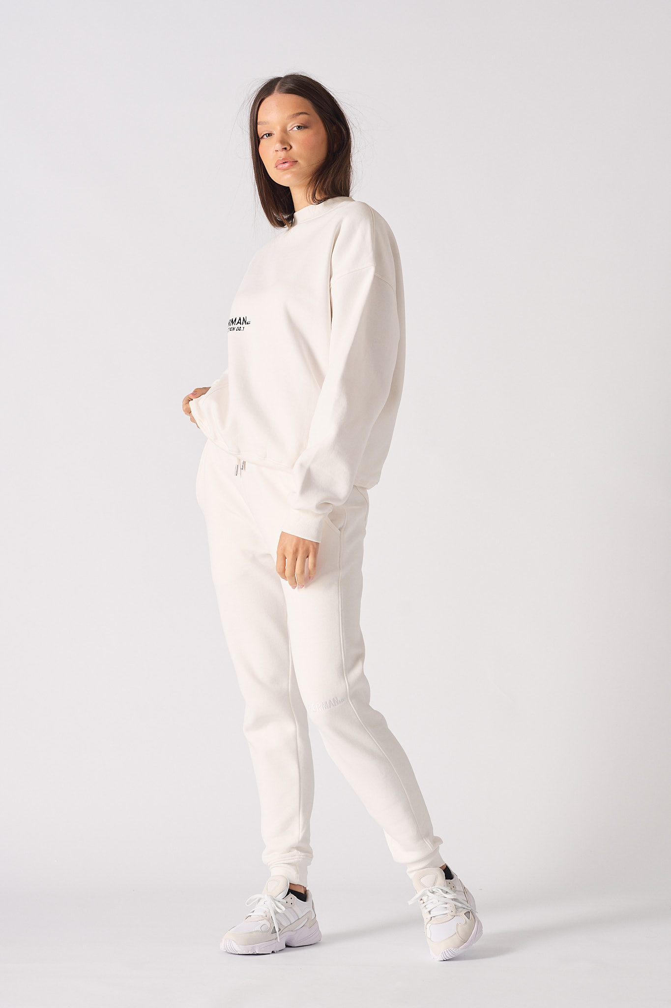 Rear full body view showing the fit and back logo of the white jumper