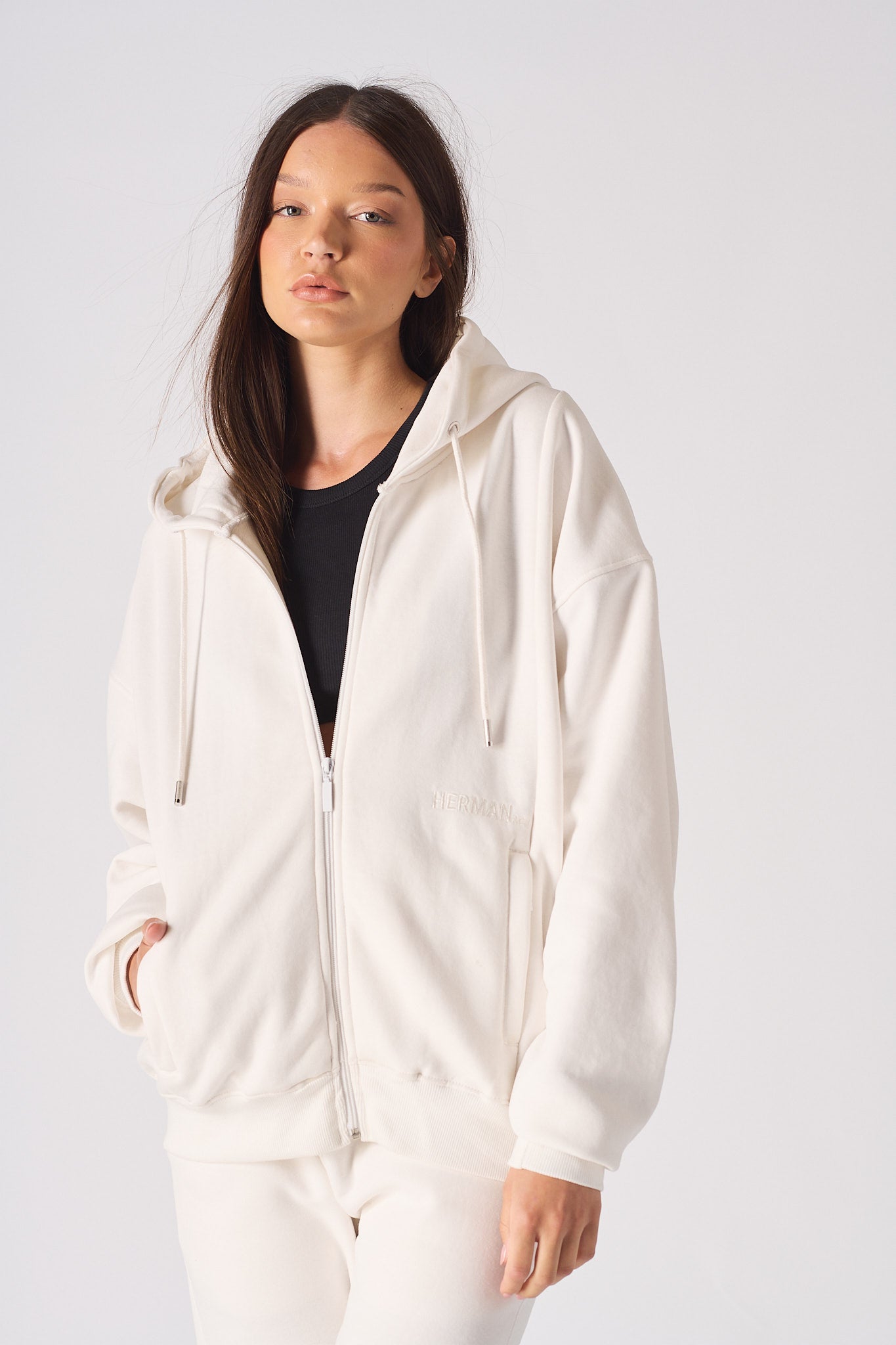 Front close-up of the white zip-up hoodie for women.