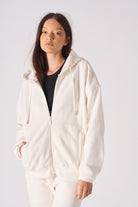 Front close-up of the white zip-up hoodie for women.