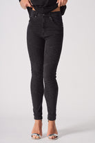 Front view of the women's black jeans in a biker style.