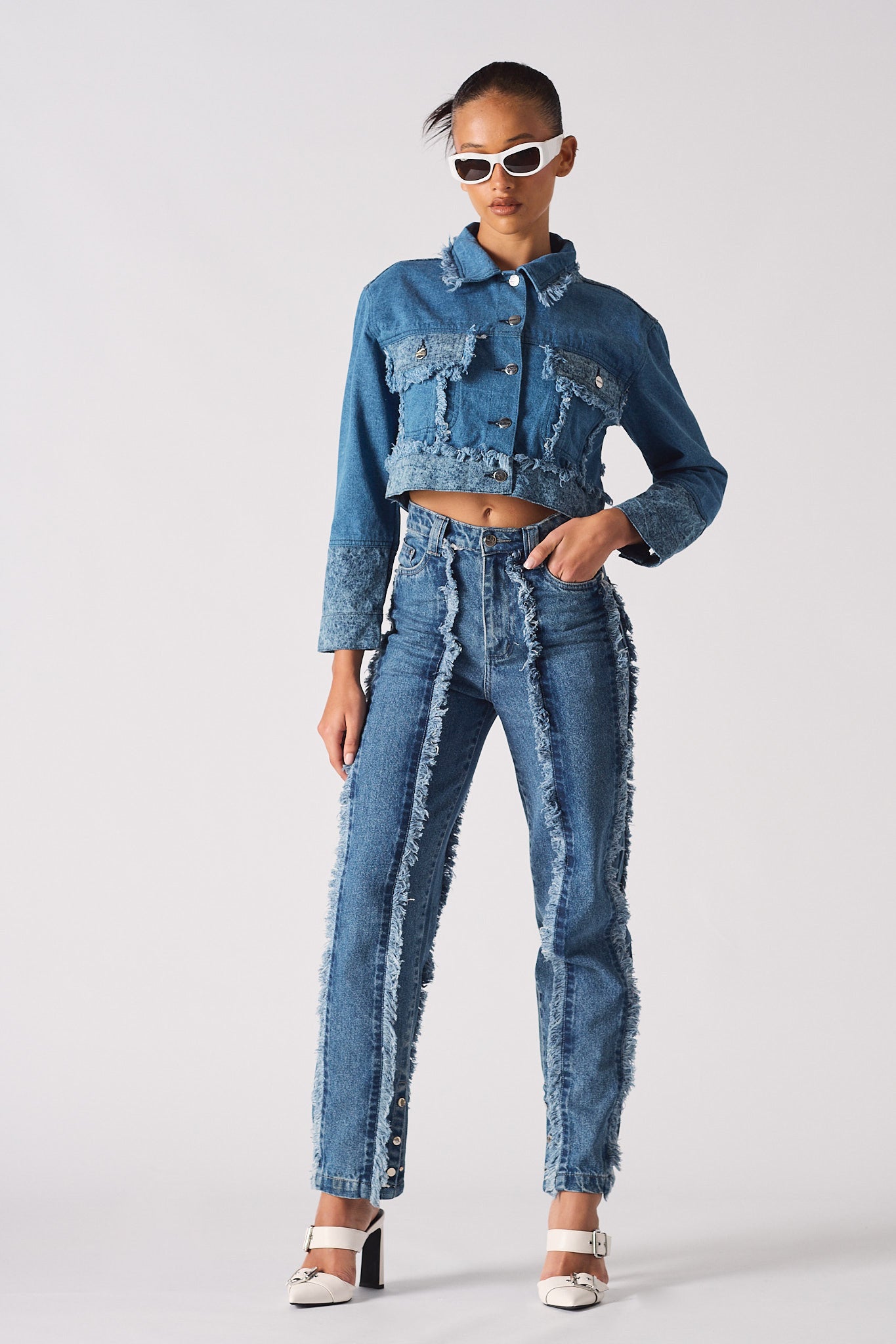 Full look of a model styled in the women's two-tone denim outfit.
