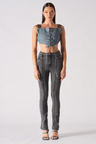 Full front view of a model styled in the women's acid grey flare jeans.