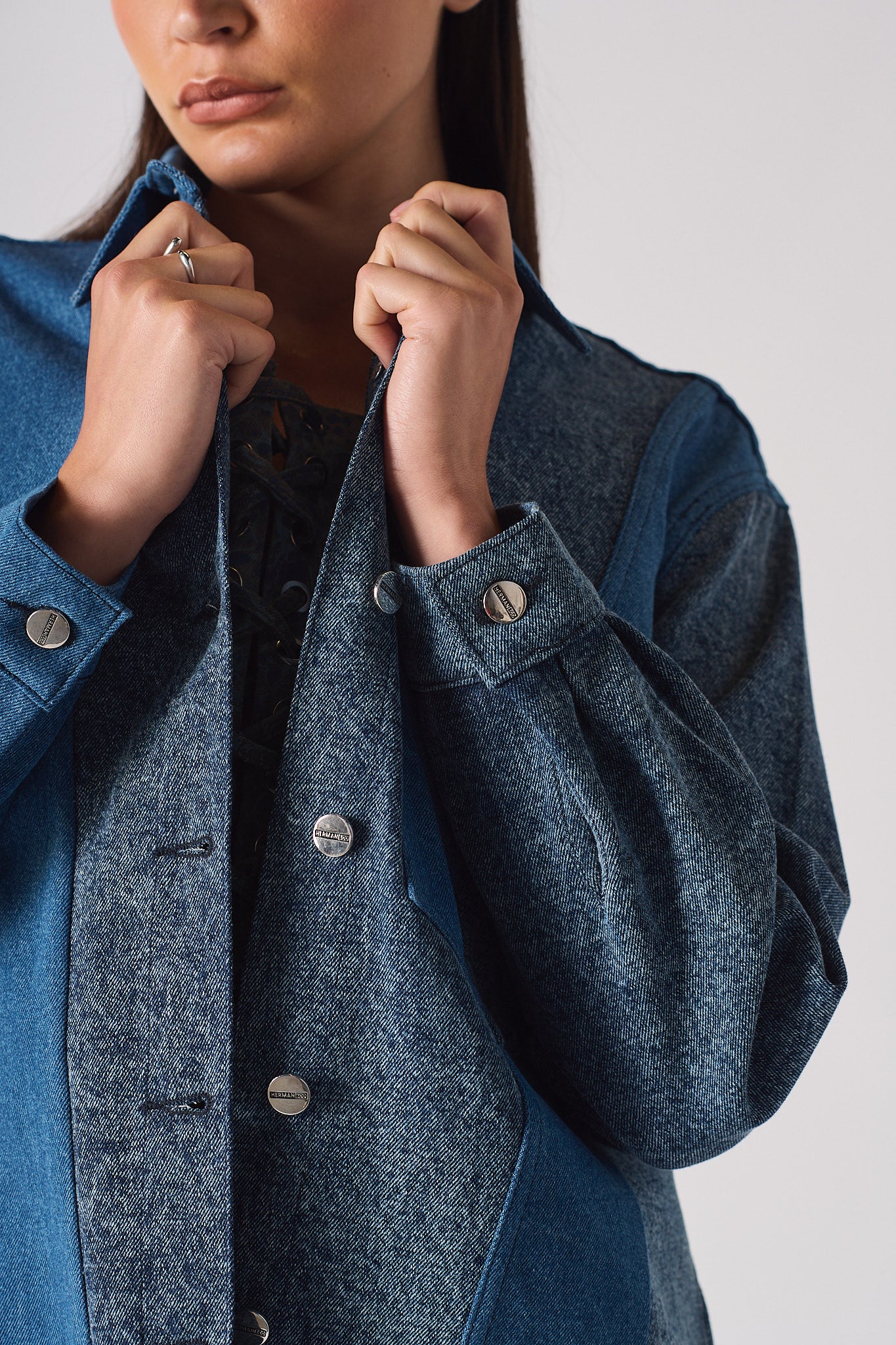 Close-up of the contrast pocket on the women's acid wash denim shirt.