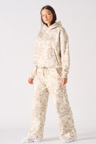 Front full body view of essential beige tie dye wide leg joggers for women