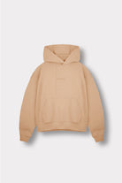 Flat lay front view of essential womens beige hoodie with kangaroo pocket