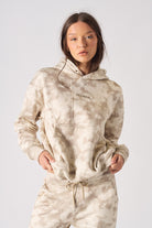 Close up detail of the hood and neckline structure on womens beige pullover