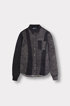 Women's black acid wash denim shirt with contrast panels, laid flat.