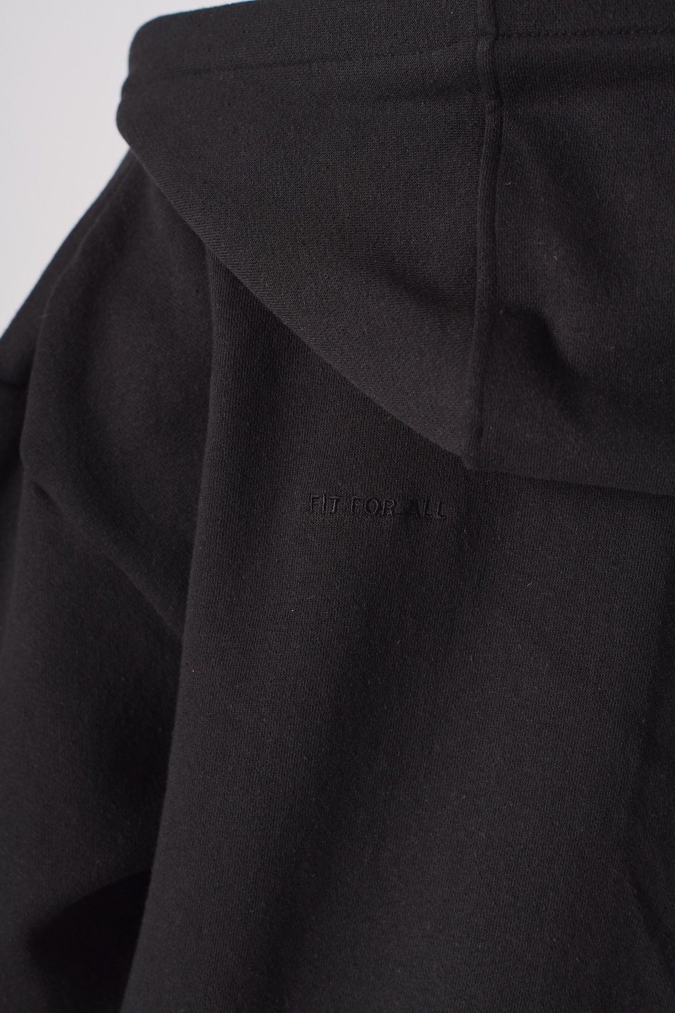 Close up detail of the hood structure on black zip up hoodies for women