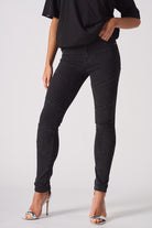 Front close-up of the women's black skinny biker jeans showing the ribbed knee detail.