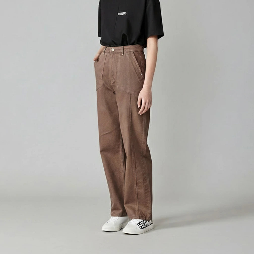 Side profile of a model wearing the women&#39;s brown baggy jeans.