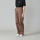 Side profile of a model wearing the women's brown baggy jeans.