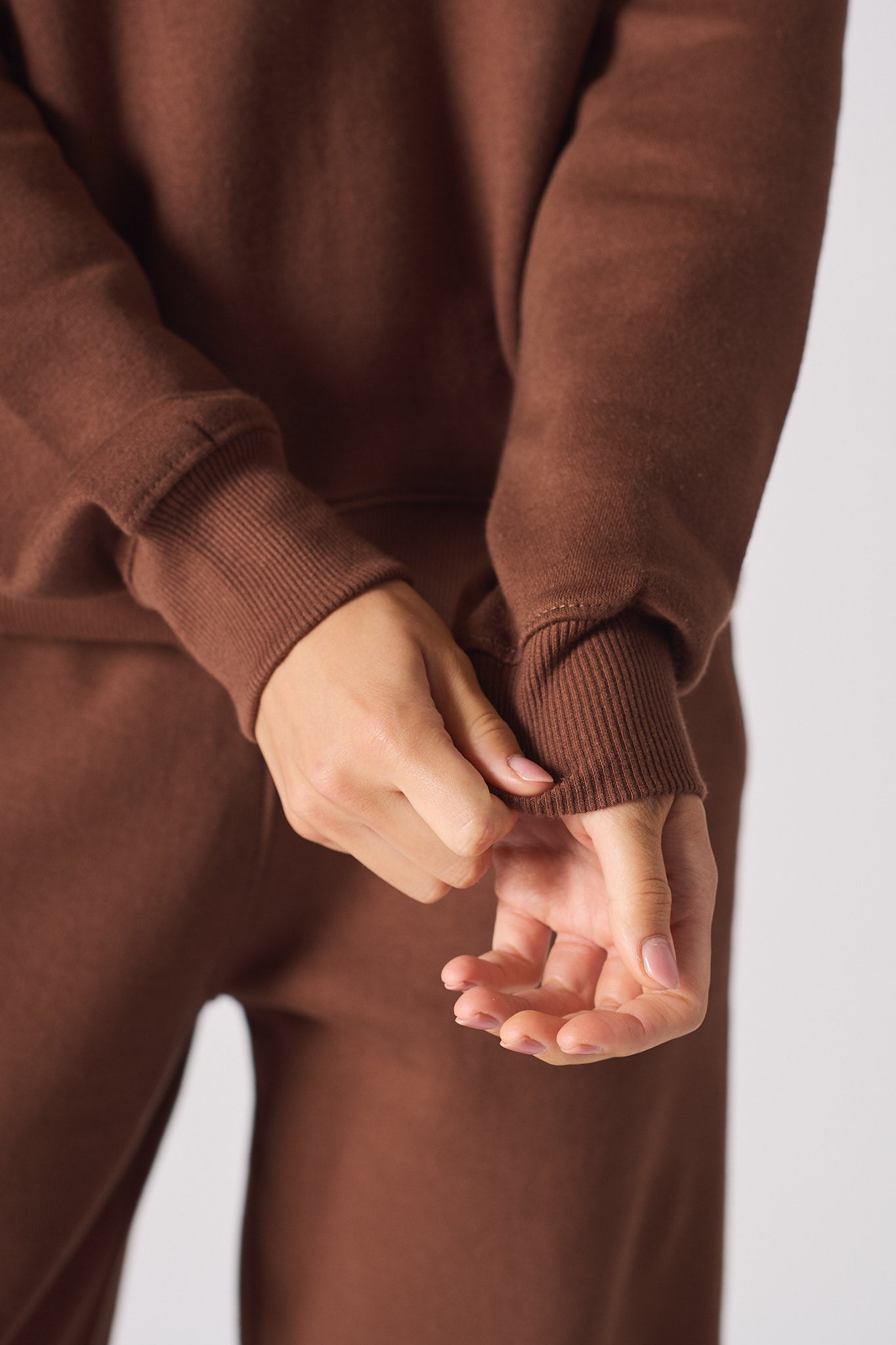 Flat lay front view of the essential brown crew neck jumper womens