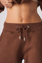 Close-up of the drawstring waist on the women's brown joggers.