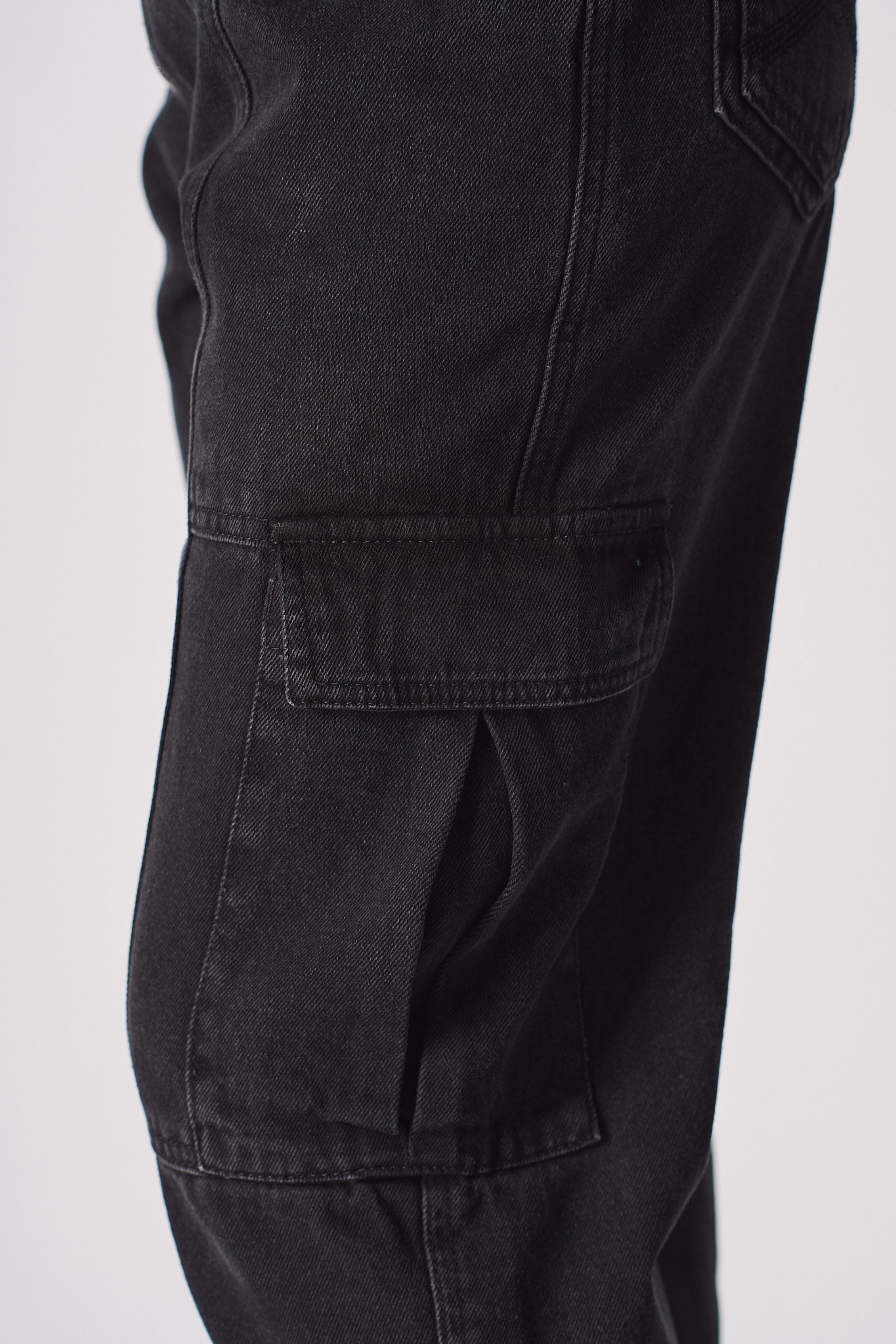 Detailed view of the side cargo pocket on the women's jeans.