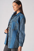Back view of the women's contrast wash denim shirt laid flat.
