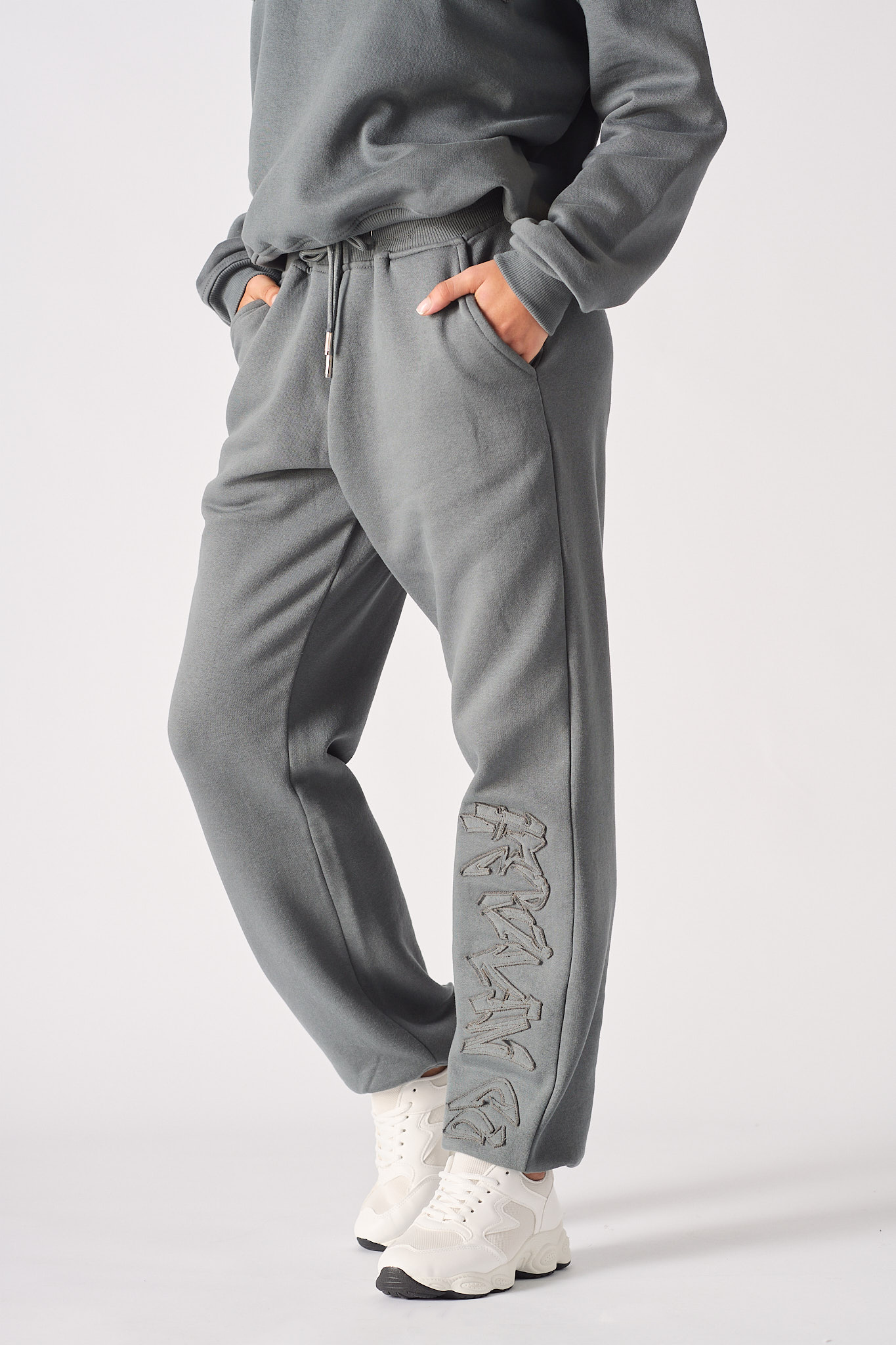 Front close-up of the women's grey embroidered cuffed joggers.