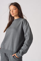 Flat lay front view of essential women's grey crew neck jumper