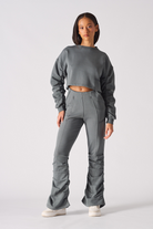 Detailed close up of the high waistband on womens grey joggers