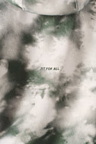 Close up angle showing the shoulder fit of the womens dark green tie dye hoodie