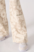Back flat lay view of comfortable beige tie dye wide leg joggers