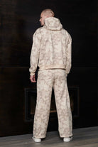 Rear full body view of mens wide leg joggers in beige tie dye