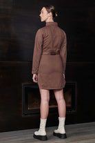 Back view of the belted denim shirt dress in brown, showing the fit