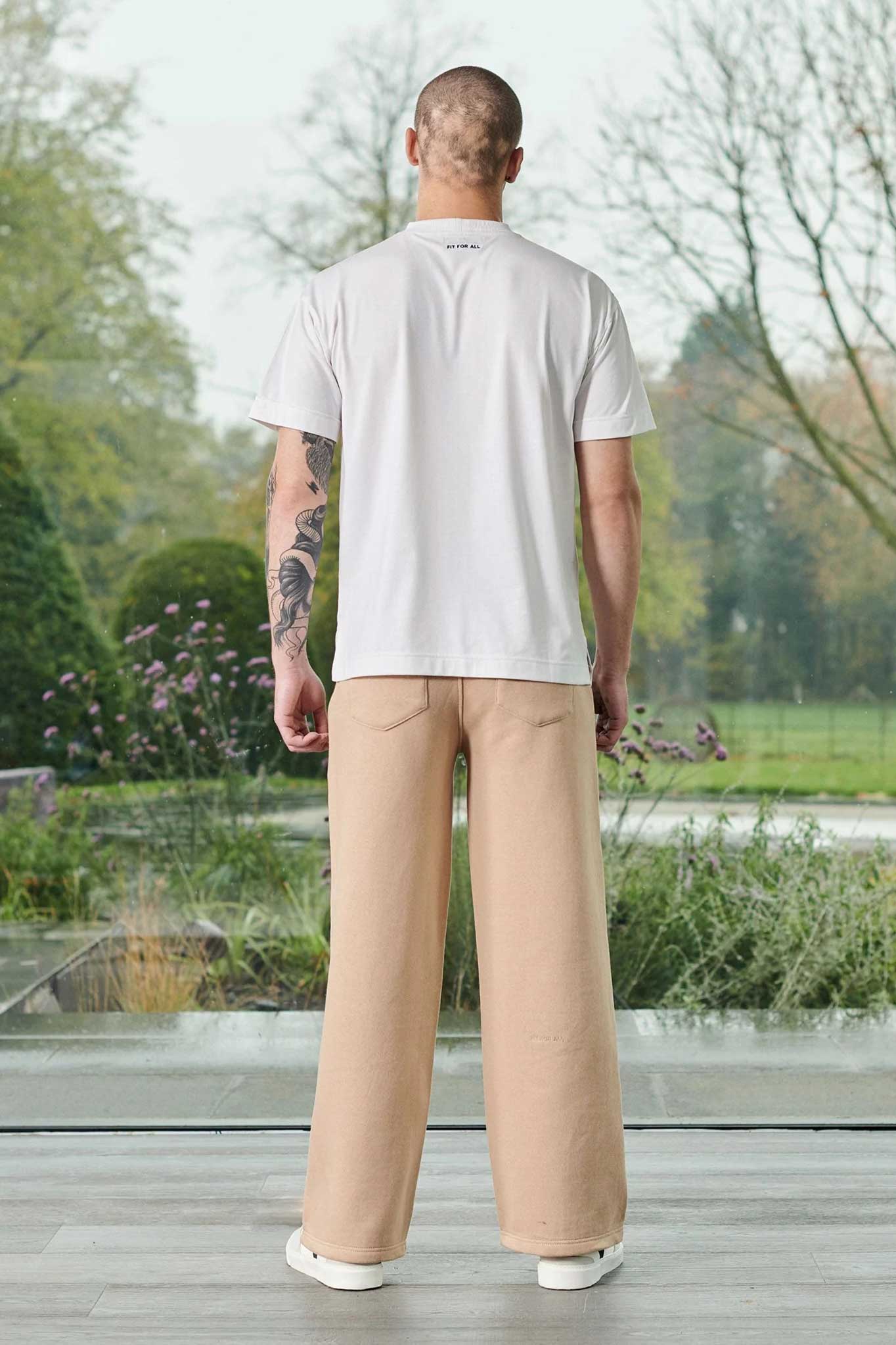 Back view of a man in a big size white t-shirt.