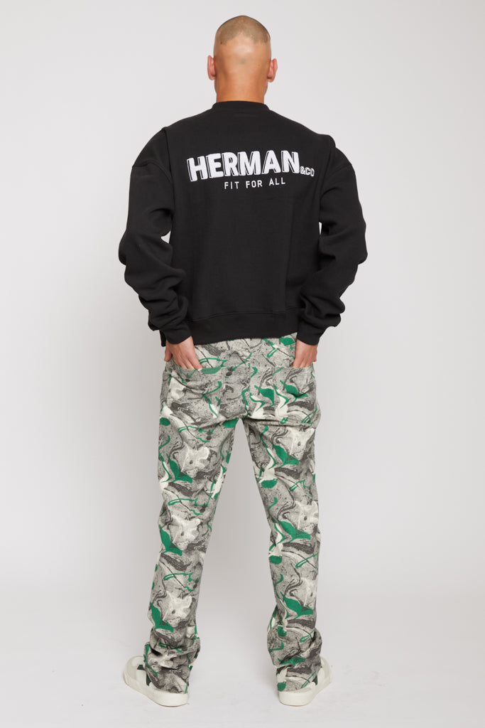 Back view of a model in the men&#39;s black crew neck jumper showing the large back print.