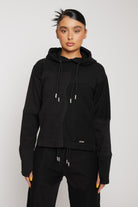 Close up view of the chest panel and drawstring on women's black fitted hoodie