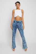 Front view of women's blue acid wash bootcut jeans