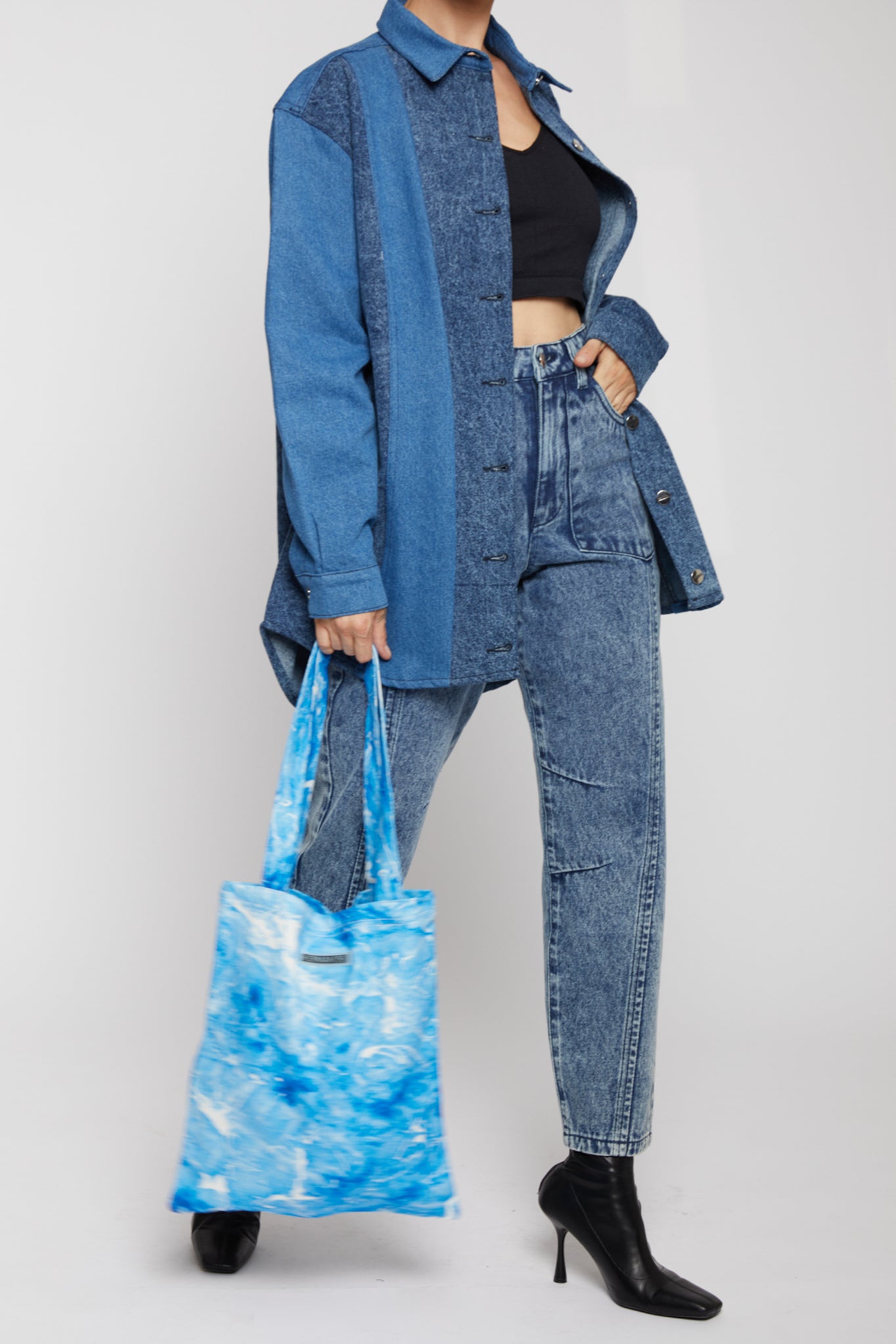 Styling the blue and white printed denim tote bag with a denim outfit.