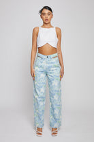 Full front view of a model in the blue psychedelic marble print jeans.