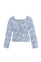 Front view of the blue and silver marble print top laid flat.