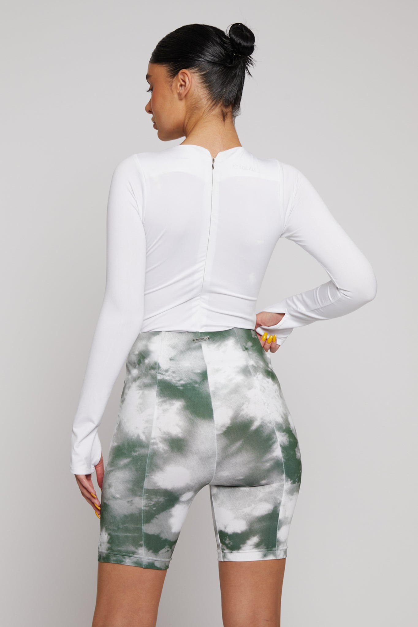 Back view of the bodysuit showing the zip detail at the neck.