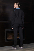 Back view of a model in the denim and fleece jacket for women.