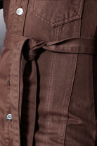 Close-up of the tied waist belt on the denim shirt dress