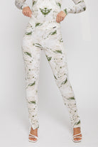 Close-up of the dipped waist leggings showing the intricate print and v-shape waistband.