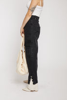 Side view of the ecru canvas tote bag showing its shape