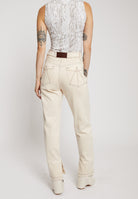 Back view of the ecru denim jeans showing the unique pocket stitching.