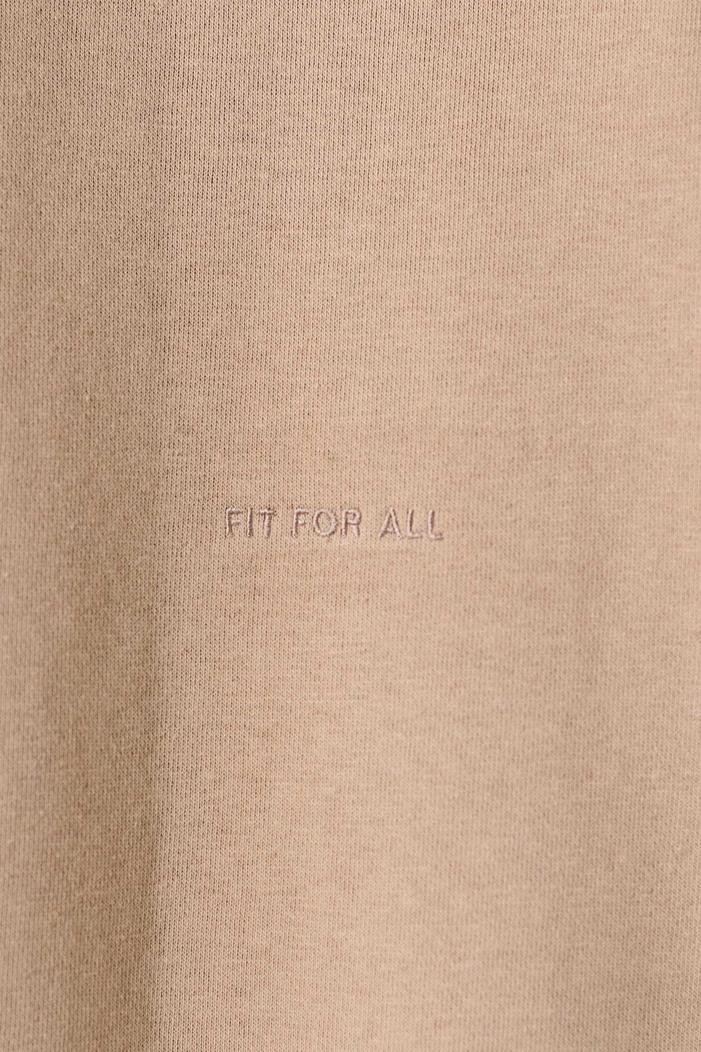 Close-up of the 'Fit For All' tonal embroidery detail