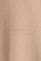 Close-up of the 'Fit For All' tonal embroidery detail