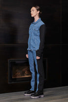 Side profile of a model showing the fit of the fleece denim jacket for women.