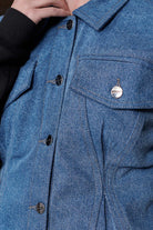 Close-up of the collar and button details on the women's fleece jean jacket.