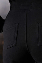 Close-up of the back pocket detail on the fleece section of the joggers