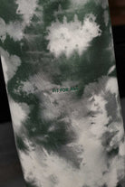 Close-up of the green and white tie-dye pattern on the joggers.